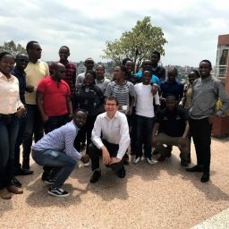 Alex Noyvirt, Senior Data Scientist at the Data Science Campus is presenting a picture of a unicorn to data science PhD students at the University of Rwanda.